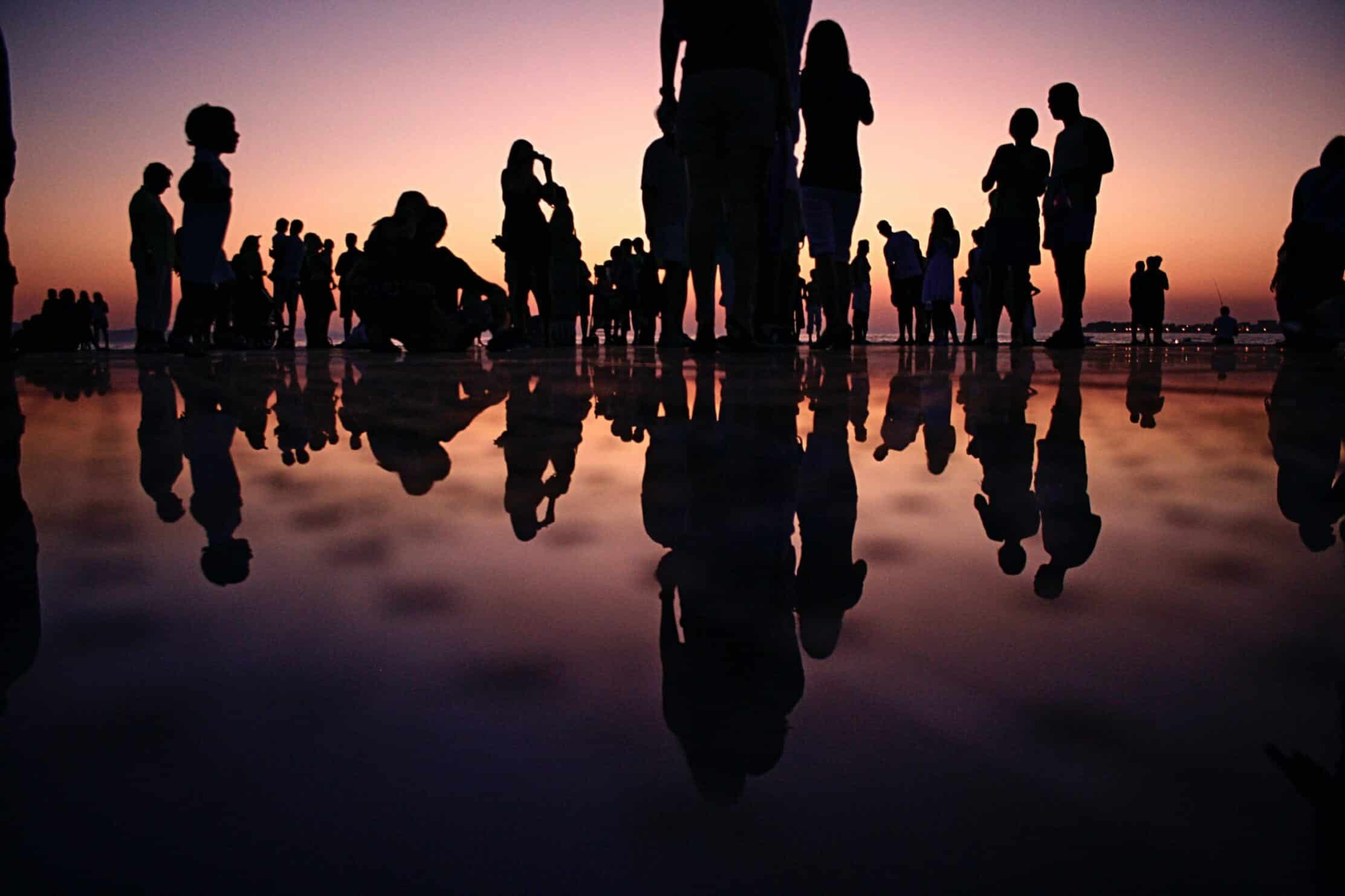 Silhouette of people gathered